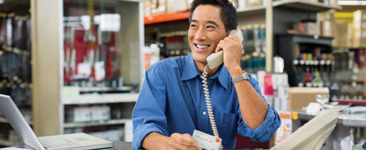 Business man speaking on a telephone